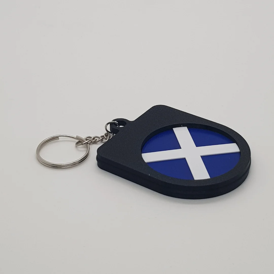 Angled rear view of a Scotland football keychain showing the national flag inset.