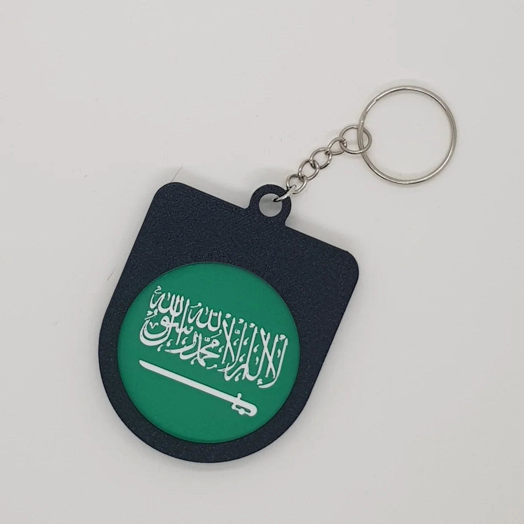 Rear view of a Saudi Arabia football keychain showing the national flag.