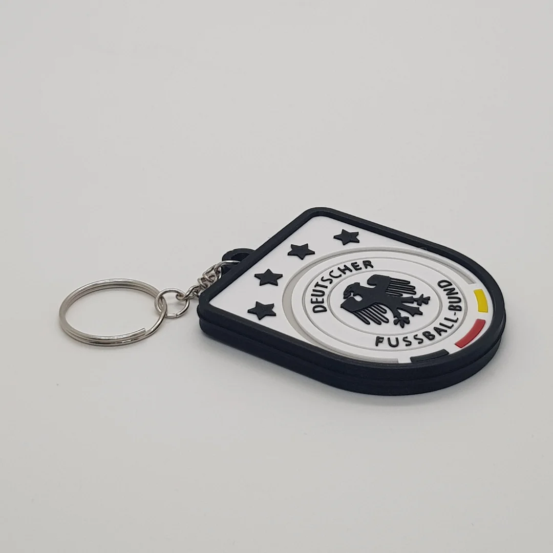 Angled front view of a Germany football keychain showing the raised crest and metal key ring.