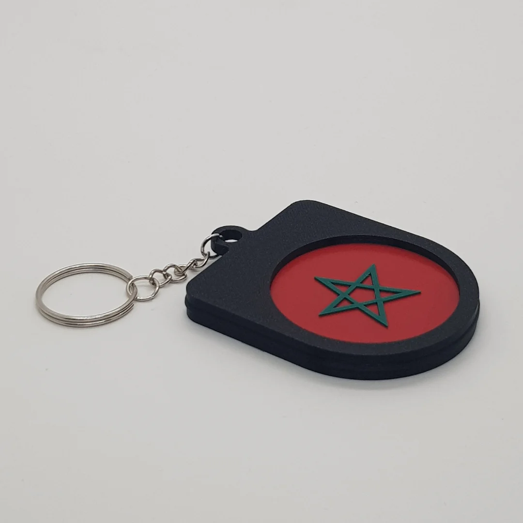Angled rear view of the Morocco football keychain showing the national flag inset.