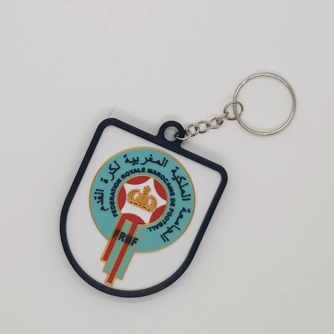 Front view of the Morocco football crest keychain with its chain and key ring.