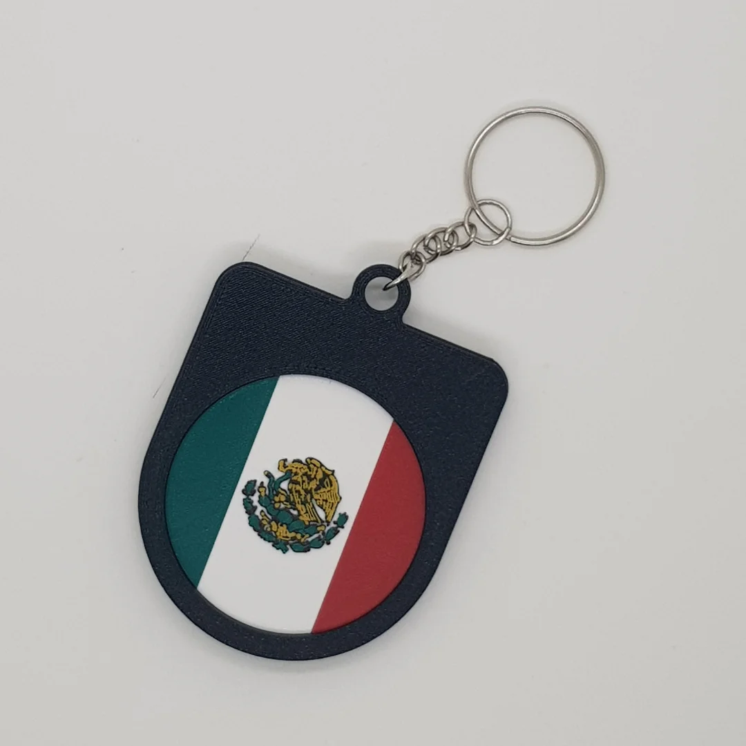 Rear view of the Mexico football keychain showing the national flag.