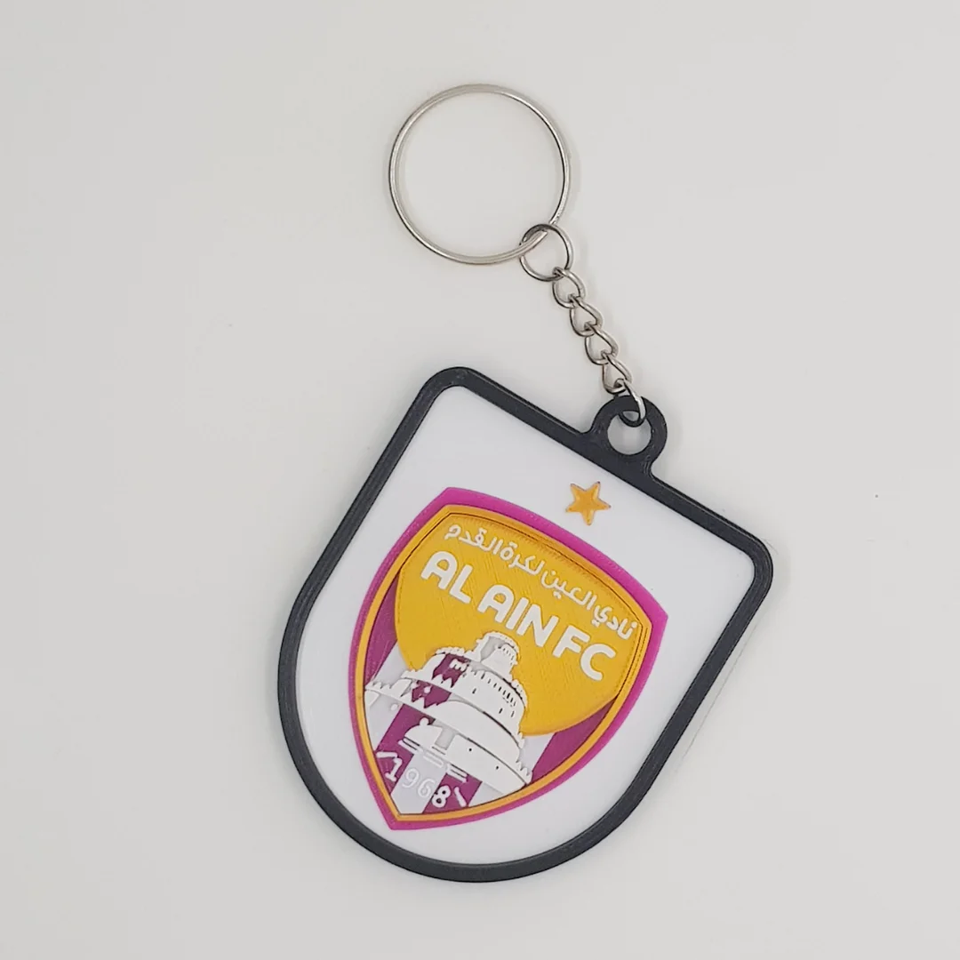 Front view of the Al-Ain FC keychain showing the club crest.