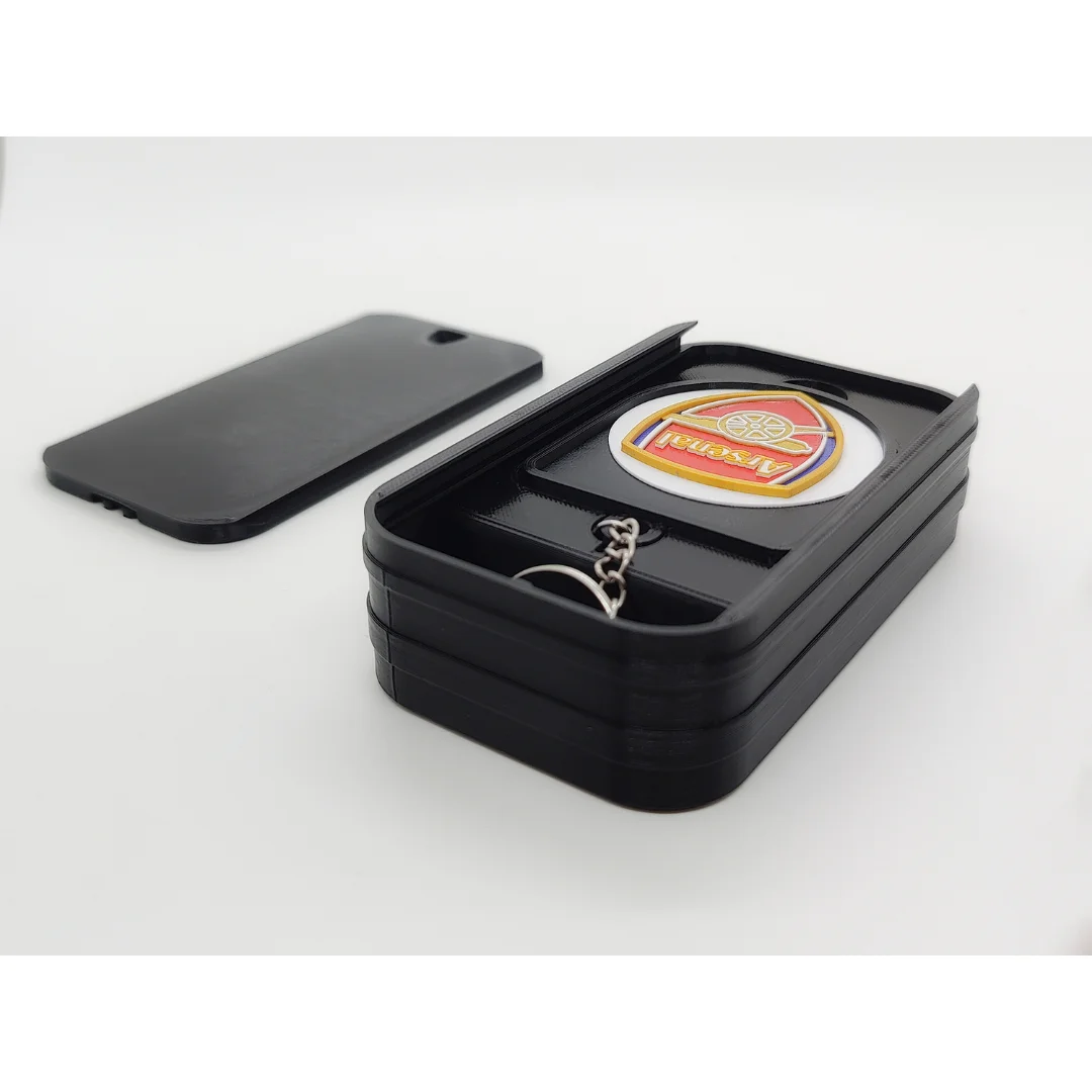 Arsenal FC keychain displayed inside an open presentation box.