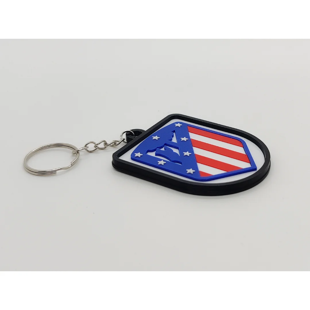 Angled view of the Atletico Madrid keychain showing the club crest and metal key ring.