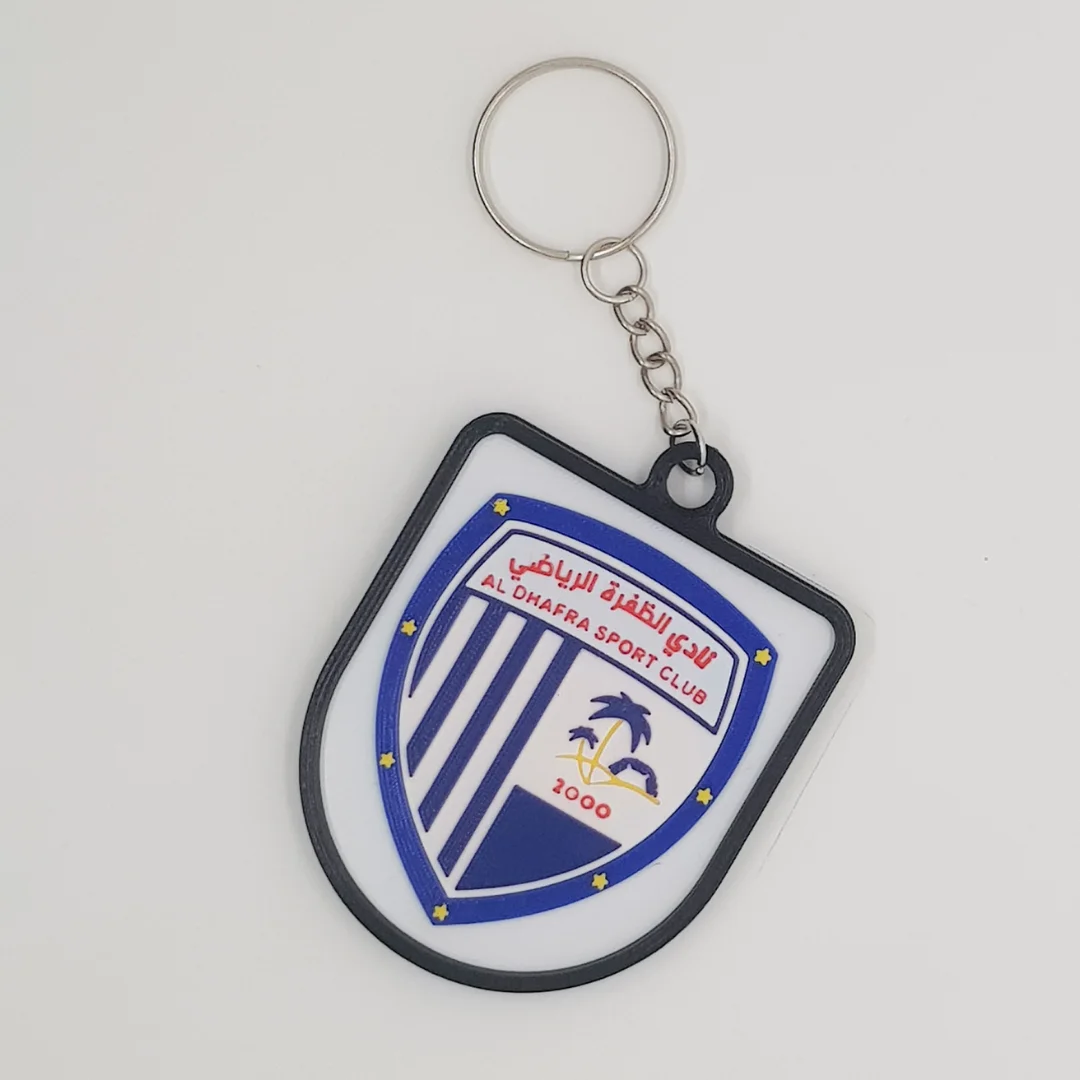 Front view of the Al Dhafra FC keychain showing the club crest.
