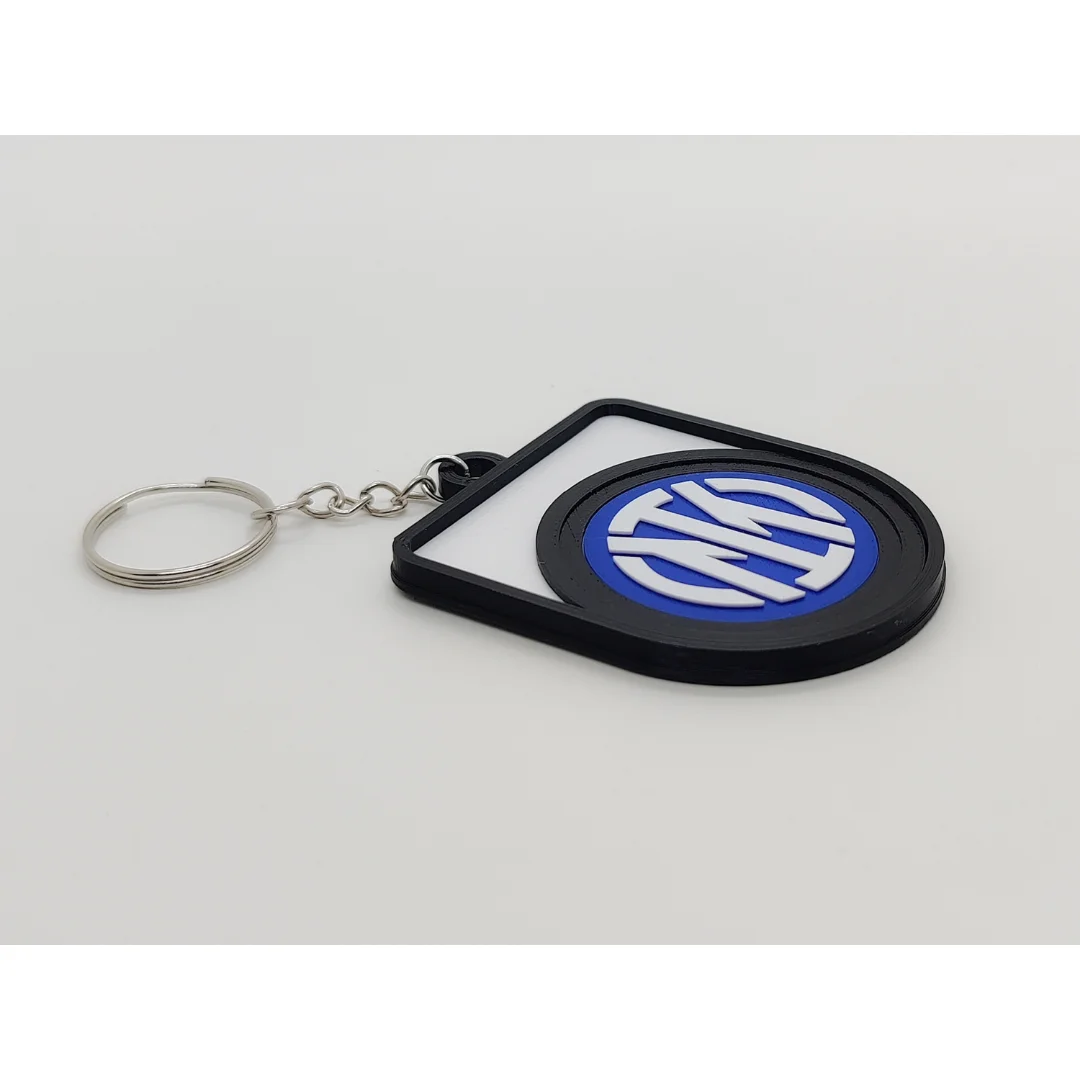 Angled view of the Inter Milan keychain showing the club crest and metal key ring.