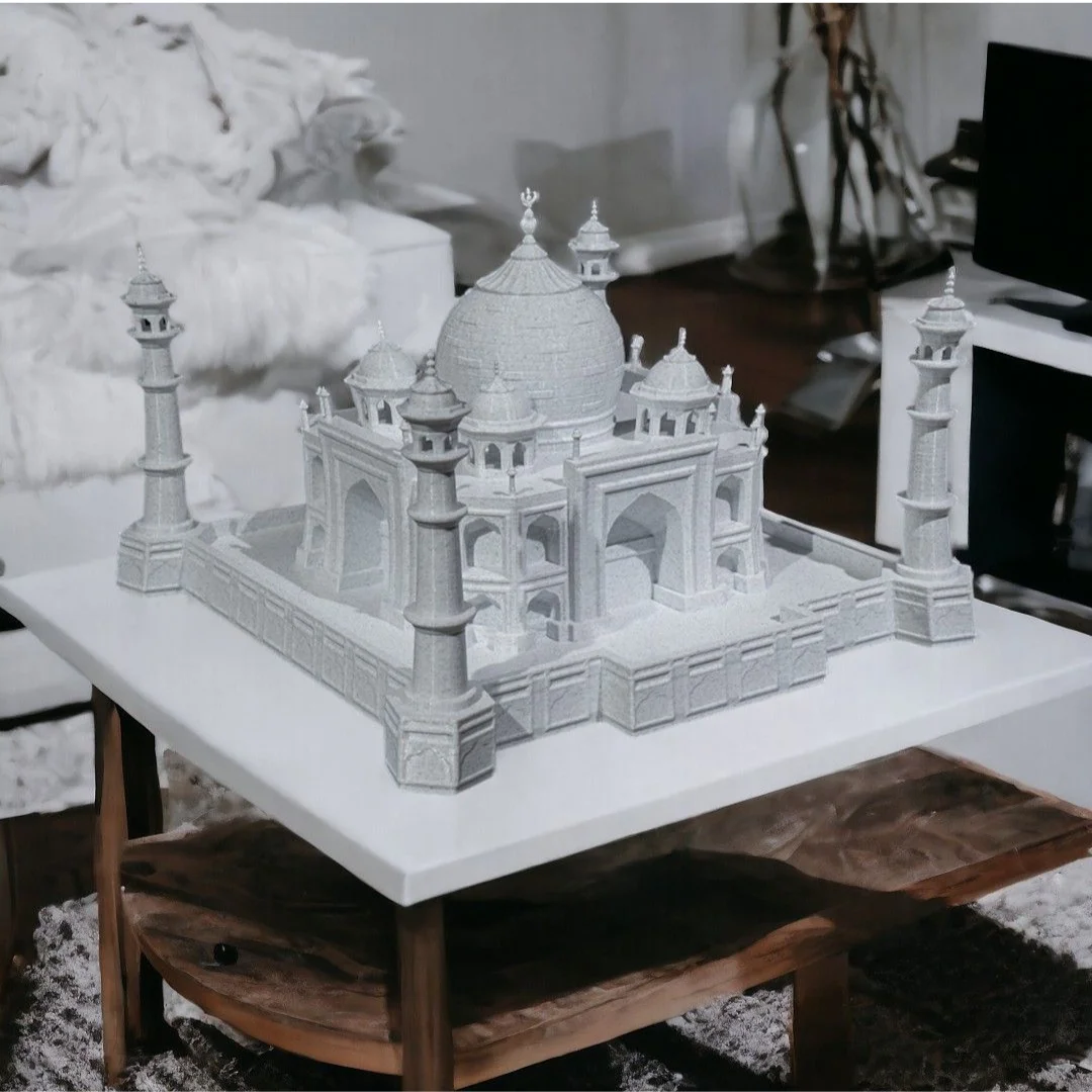 Angled tabletop view of a Taj Mahal model showing its domes and minarets.