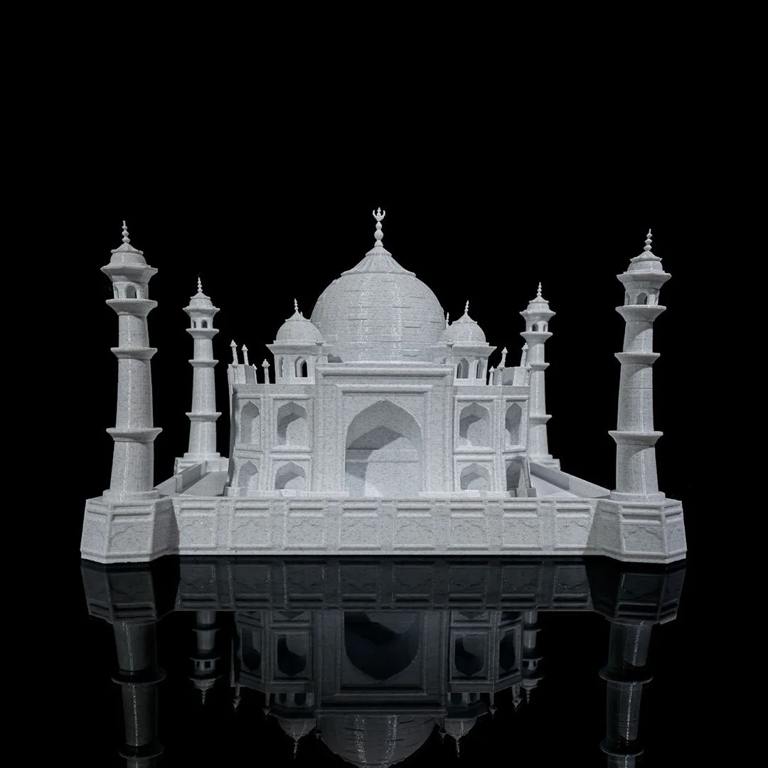 Low front view of a Taj Mahal model showing the main entrance arch.