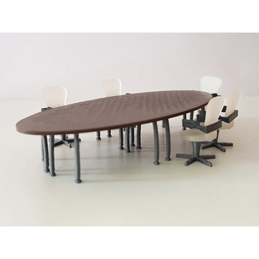 Oval meeting table miniature model at 1:50 scale shown with miniature office chairs.