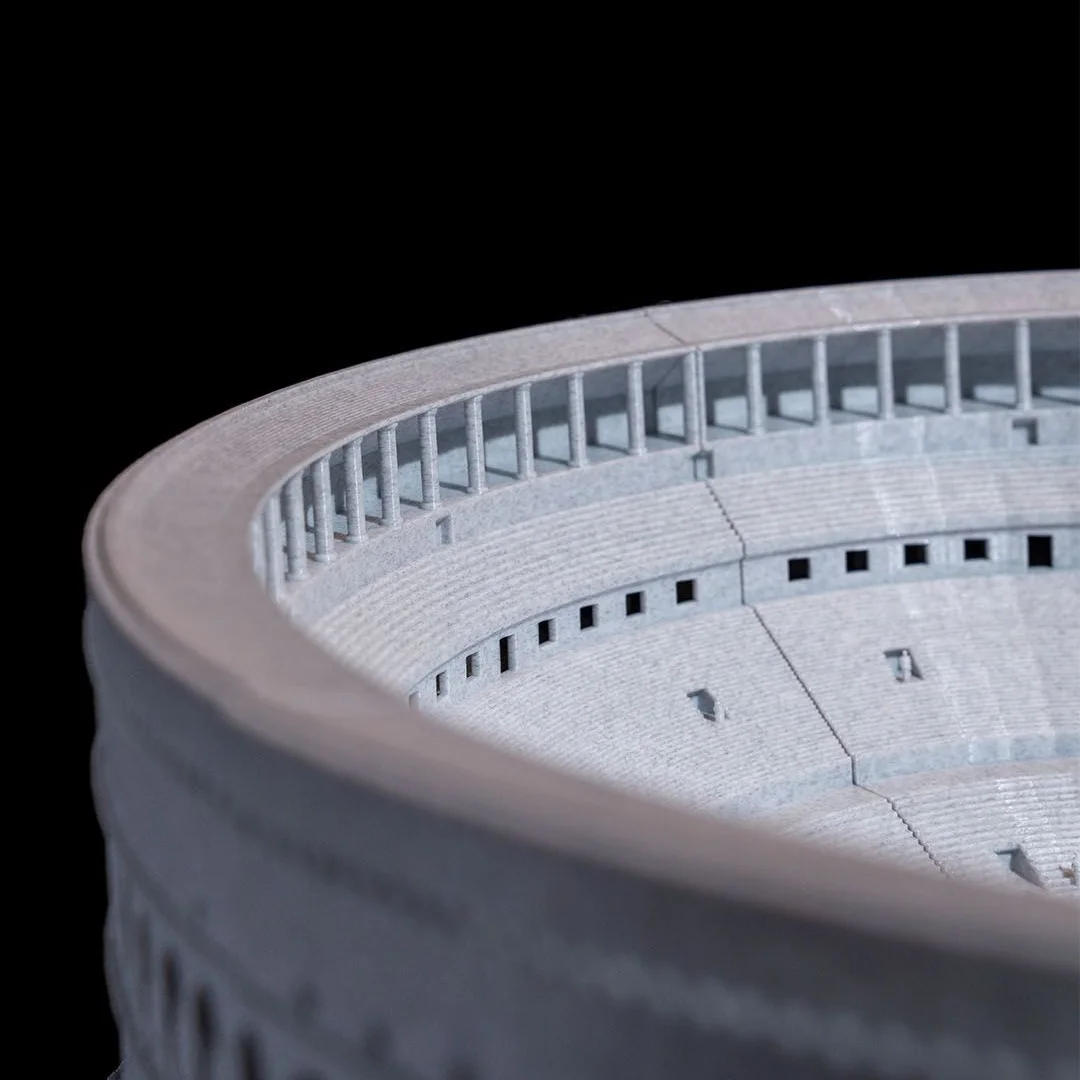 Close view of the upper rim and interior wall of a Colosseum model.