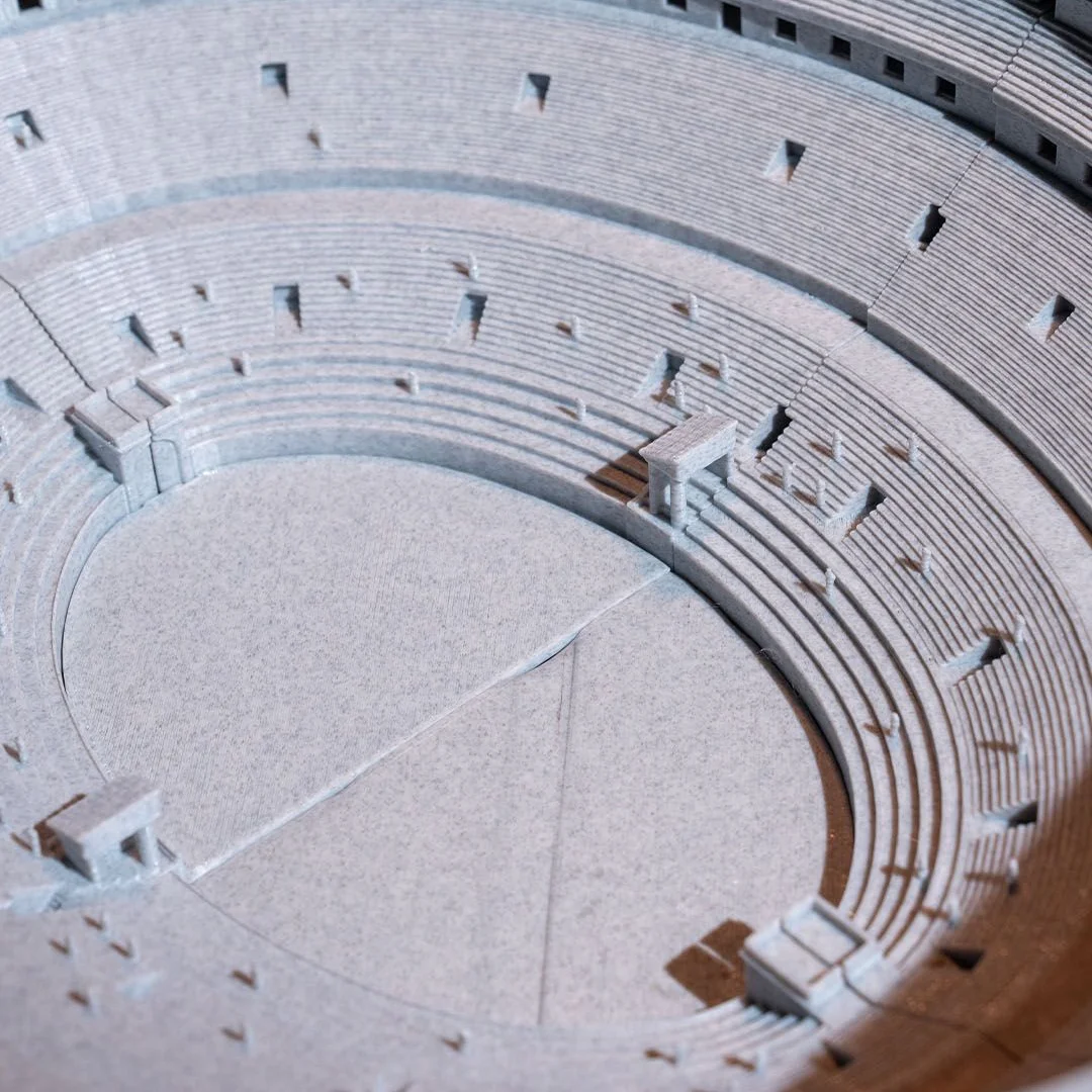 Overhead detail of a Colosseum model showing the arena floor and stepped seating.