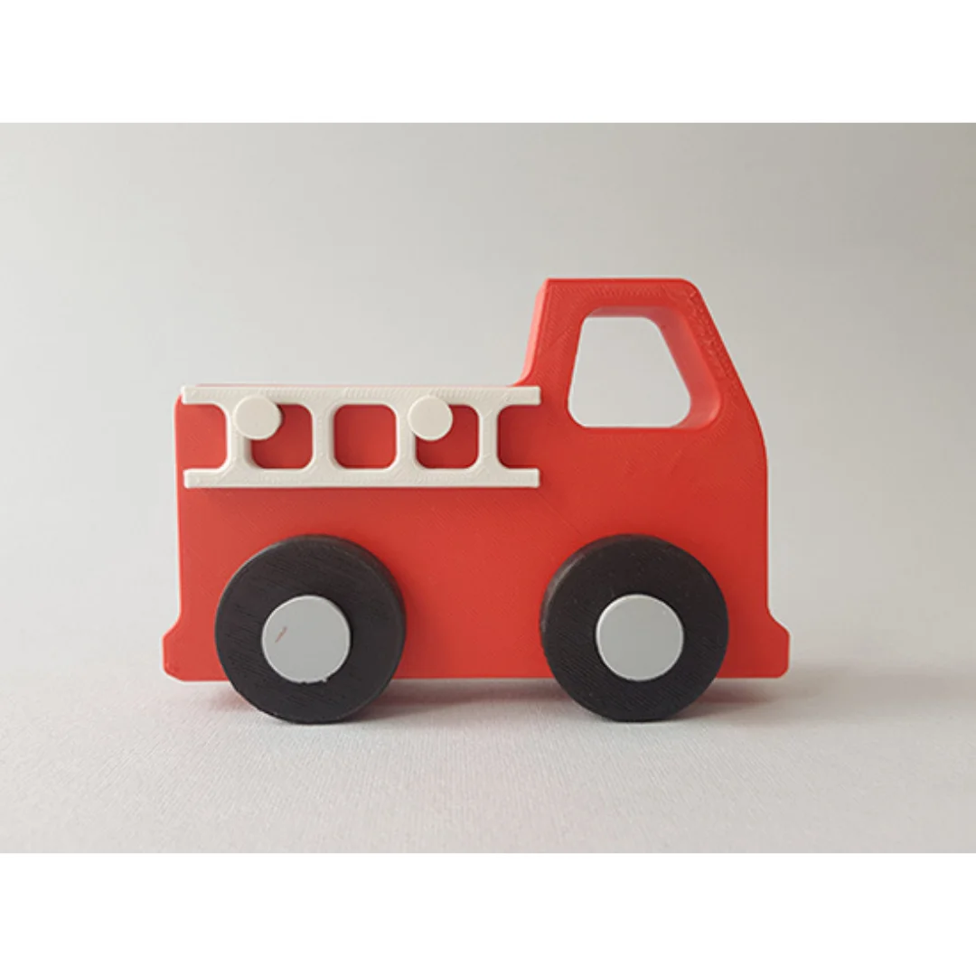 Side view of a fire engine model with a ladder detail and two visible wheels.