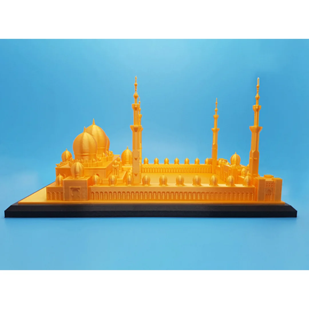 Side view of a Sheikh Zayed Grand Mosque model showing minarets and arcades.