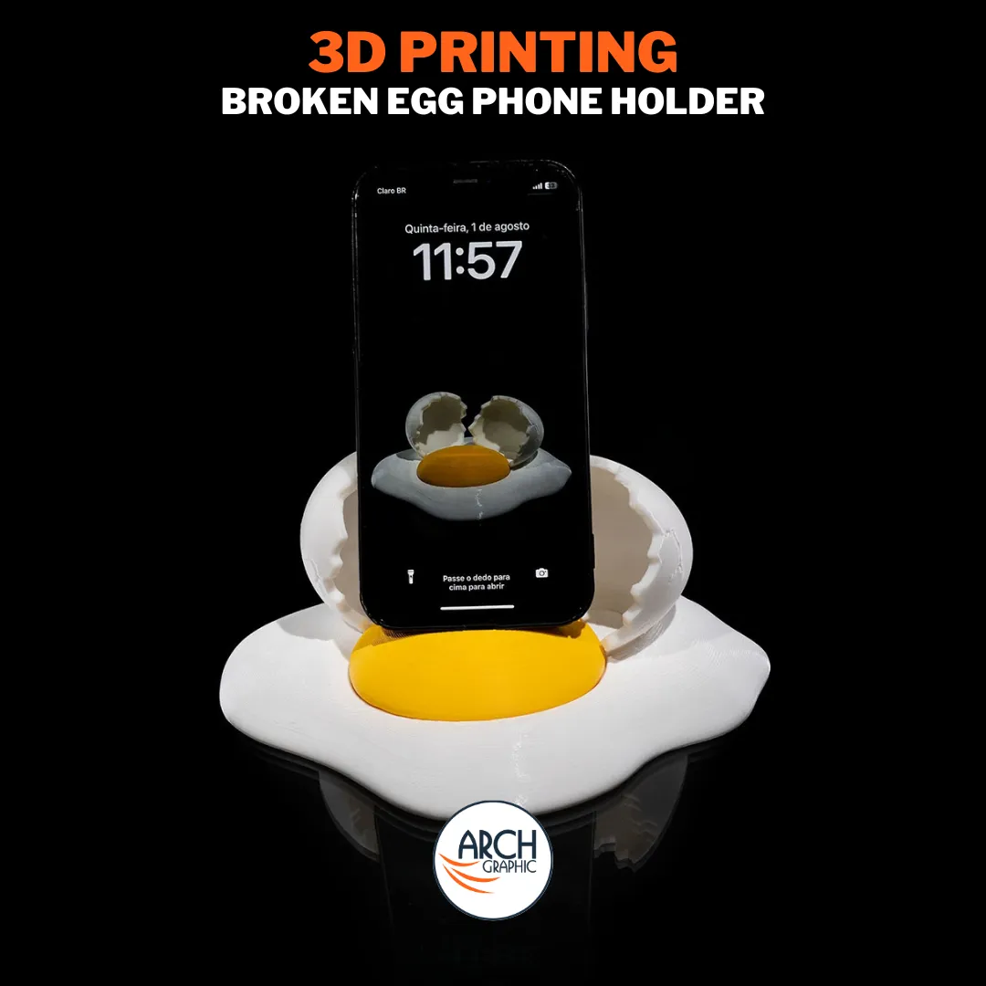 3D printed broken egg phone holder with a smartphone standing in it.