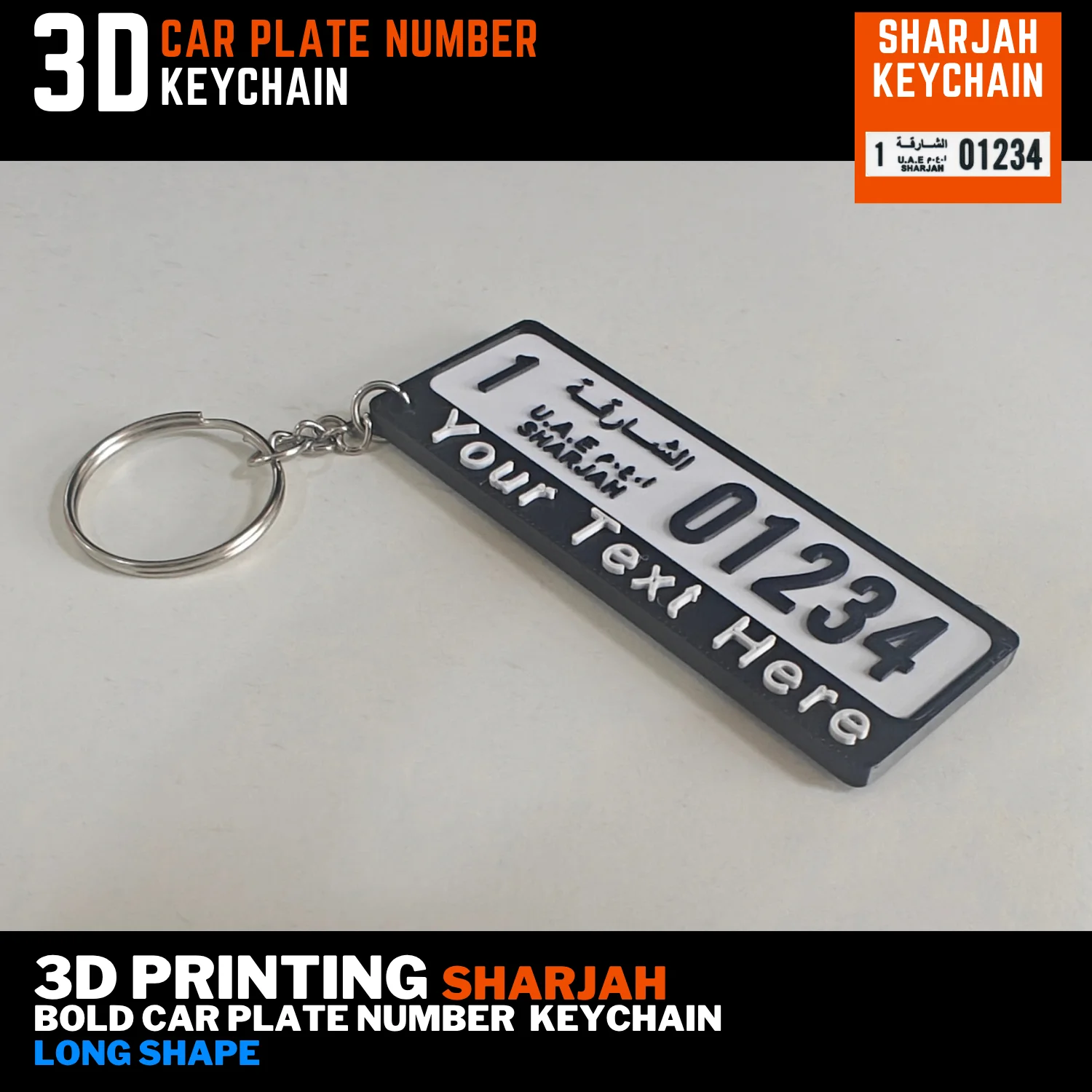 Personalised Sharjah old long plate keychain with black lettering, a custom text strip and an attached silver split ring